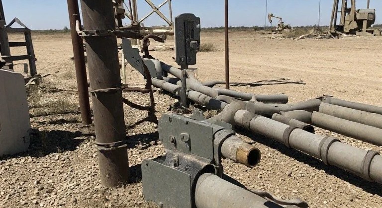 Oil field site where engineers monitor equipment daily
